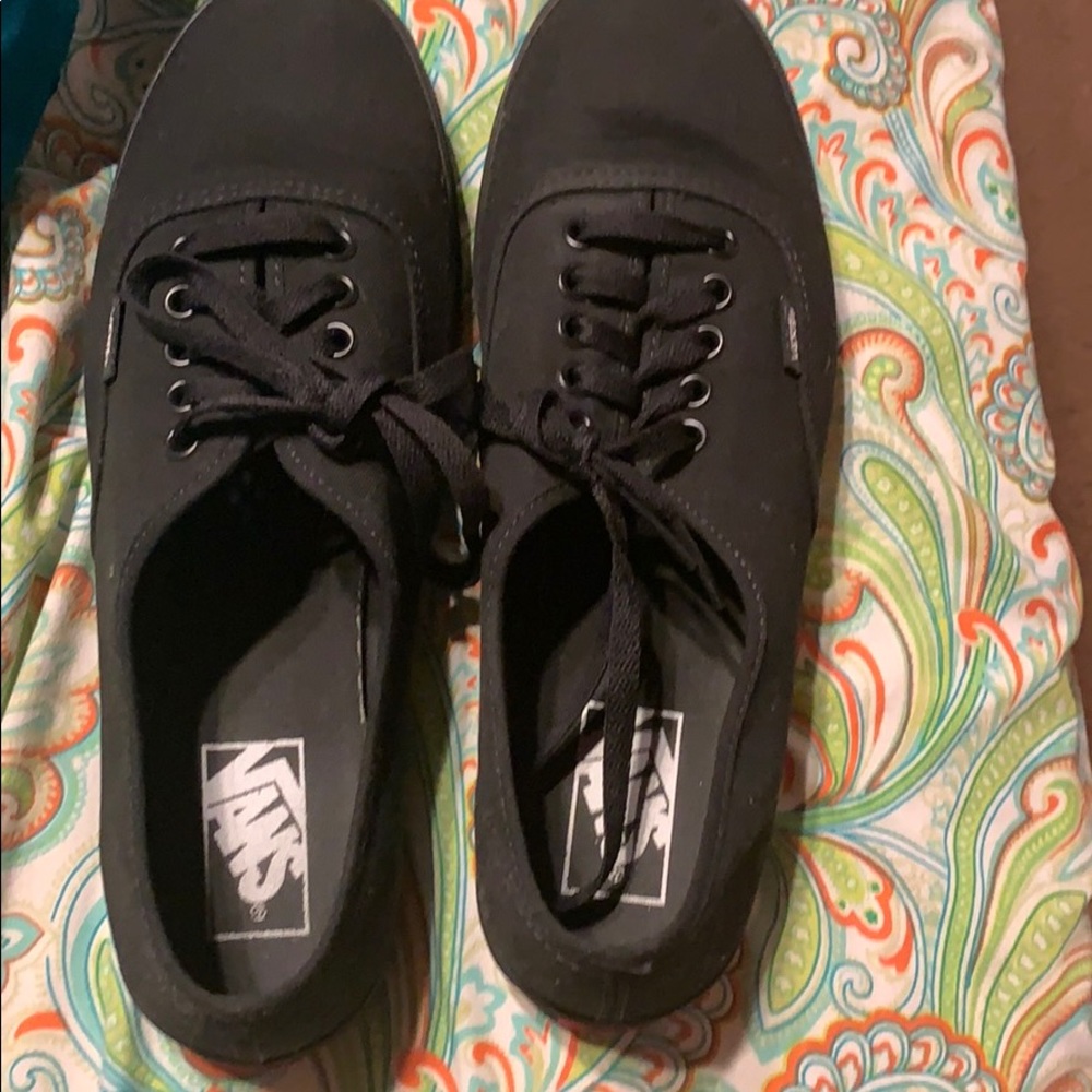 All black low top vans
